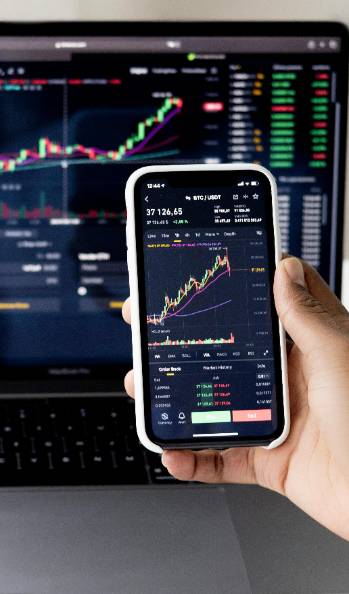 analytical marketing analysis, concentrated expression, reviewing data, photorealistic, cozy office surrounded by bookshelves, highly detailed, graphs and charts displayed on monitors, high clarity image, muted colors, overhead lighting, shot with a 100mm lens