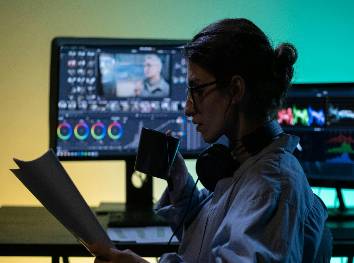 strategic content marketing, analytical, presenting findings, photorealistic, sleek conference room with graphs and charts, highly detailed, presenter gesturing towards a digital screen, cool tones, soft overhead lighting, shot with an 85mm lens.